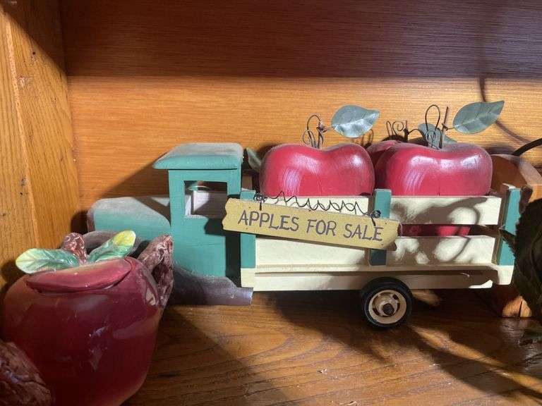 Contents of shelving including decorative Christmas buildings, ceramic planters, figurines & decor