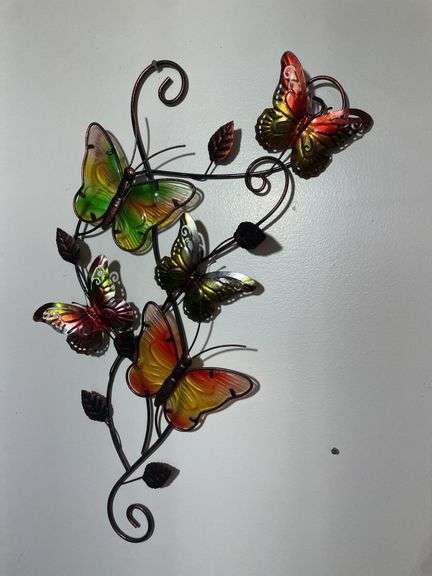 Box of decorative items including rooster clock, butterfly wall hanger, soap dispenser, kitchen item