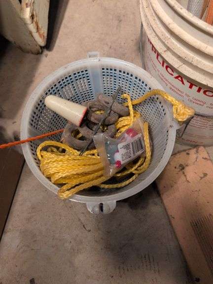 Large assortment of fishing supplies - nets, minnow traps, and more