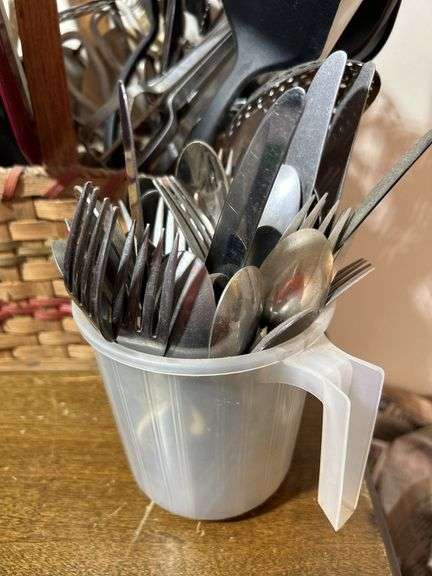 Basket with kitchen gadgets/kitchen utensils including spoons, scissors, spoons forks and more