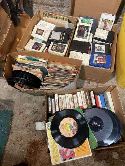 (2) boxes of 8 tracks and (2) boxes of records