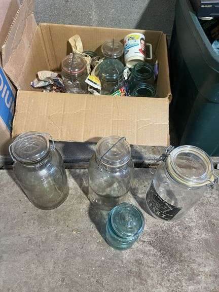 Box of jars including clear and blue - mostly Atlas