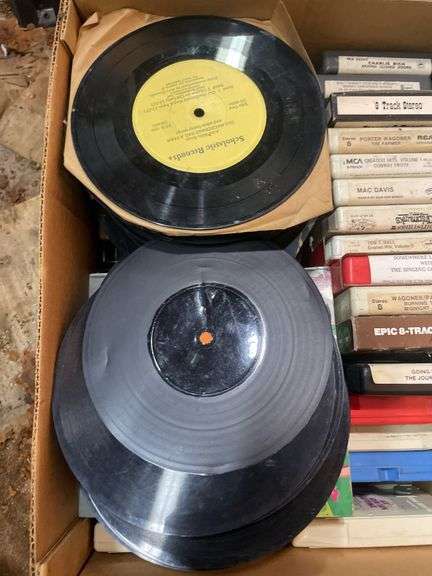 (2) boxes of 8 tracks and (2) boxes of records