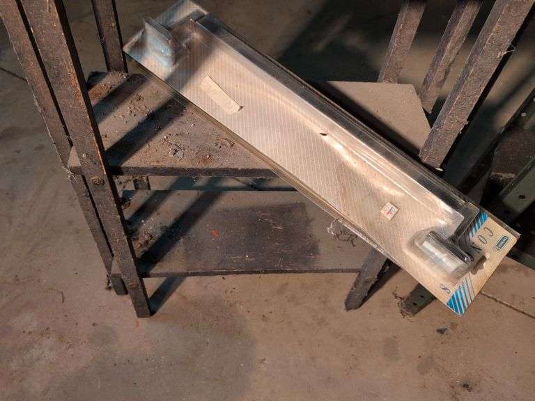 Metal shelving and wooden shelving - both with contents
