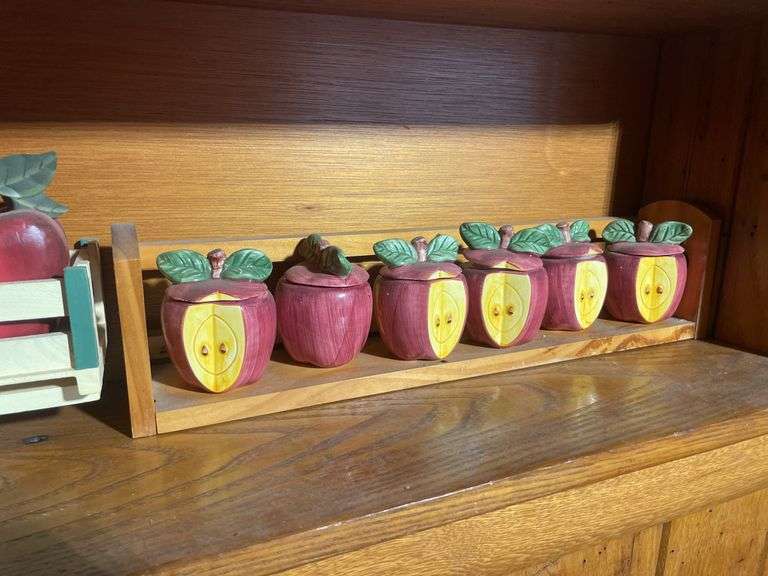 Contents of shelving including decorative Christmas buildings, ceramic planters, figurines & decor