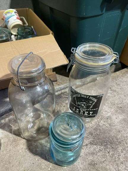 Box of jars including clear and blue - mostly Atlas