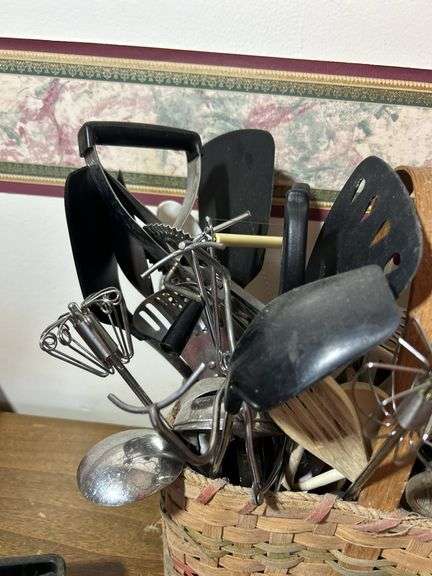 Basket with kitchen gadgets/kitchen utensils including spoons, scissors, spoons forks and more