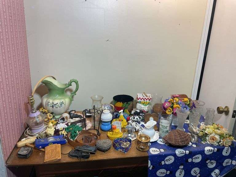 Large lot of glassware & household decor including pitcher, drinking glasses, old baby shoes and mor
