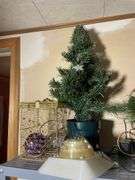 Metal shelf with Christmas decor including decorative sleigh, figurines, stuffing and more