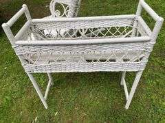 White Wicker Rocking Chair and Flower Basket