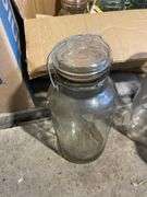 Box of jars including clear and blue - mostly Atlas