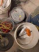 Large assortment of fishing supplies - nets, minnow traps, and more