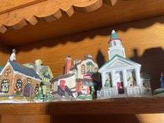 Contents of shelving including decorative Christmas buildings, ceramic planters, figurines & decor