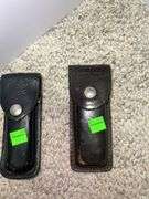 (2) Folding Knives w/ Leather Pouches