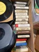 (2) boxes of 8 tracks and (2) boxes of records