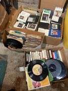 (2) boxes of 8 tracks and (2) boxes of records