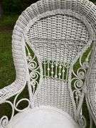 White Wicker Rocking Chair and Flower Basket