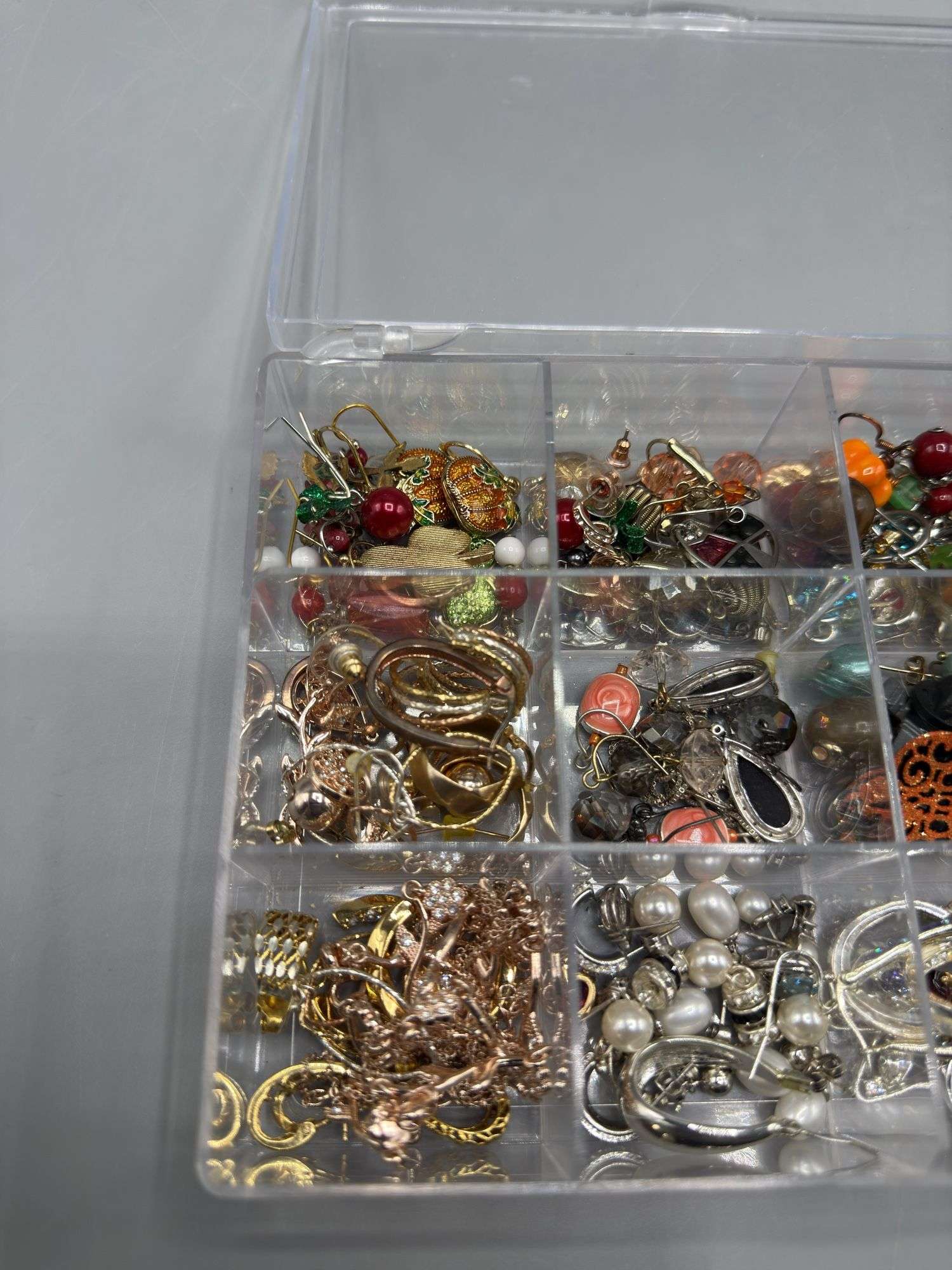 VARIETY OF EARRINGS, NECKLACES, AND PENDANTS