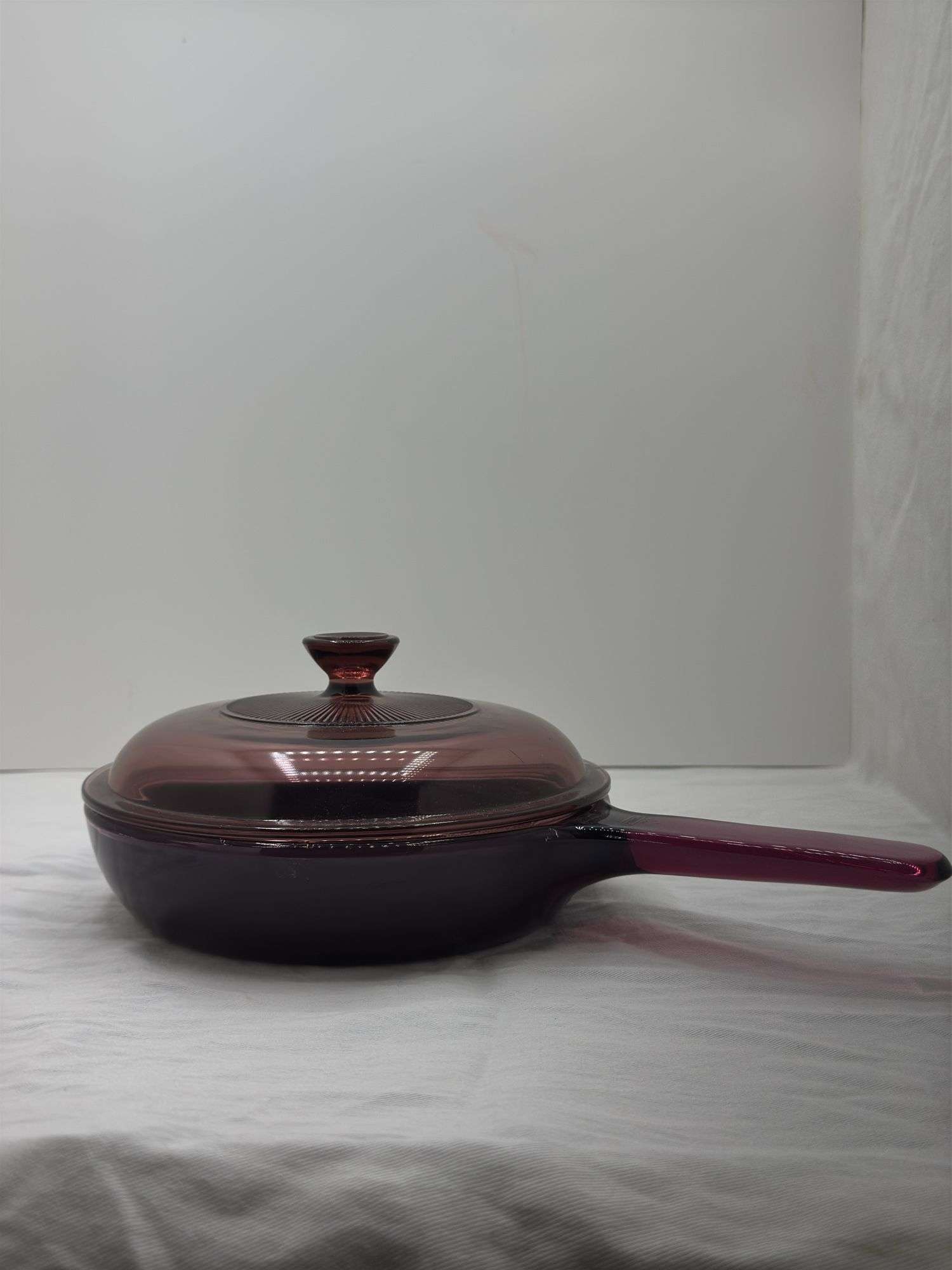 VISIONS CORNING WARE CRANBERRY FRYING PAN, HAS A FEW CHIPS ON EDGE OF LID