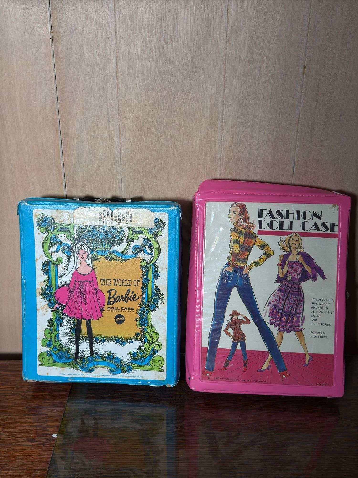 VINTAGE “THE WORLD OF BARBIE” DOLL CASE AND FASHION DOLL CASE WITH DOLLS AND CLOTHES