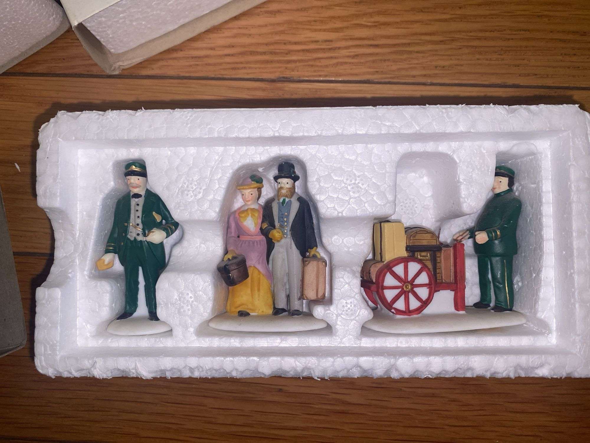 Department 56/Heritage Village “Holiday Travelers” and “A Christmas Beginning”