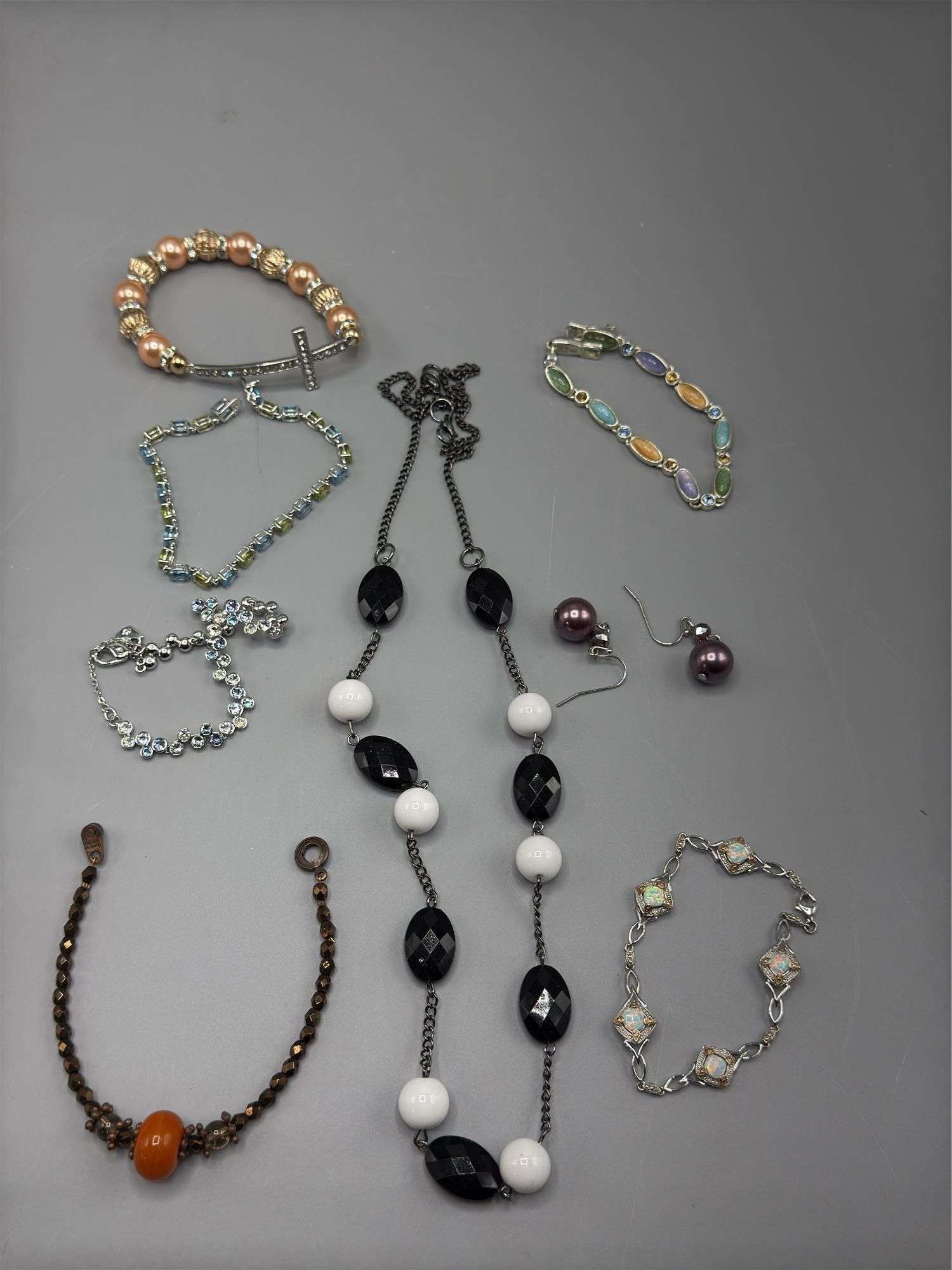 VARIETY OF BEADED NECKLACES EARRINGS AND BRACELETS