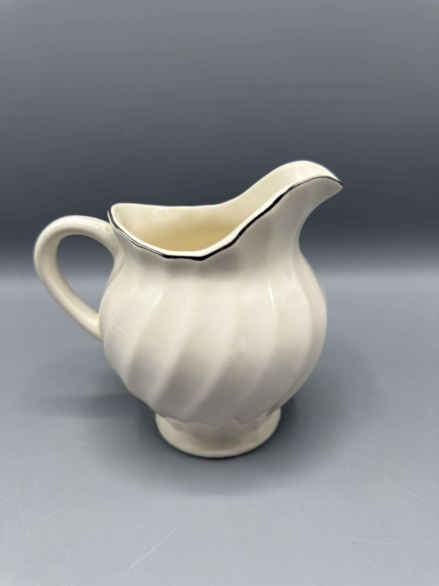 VARIETY OF PITCHERS, VASES, AND SUGAR BOWL