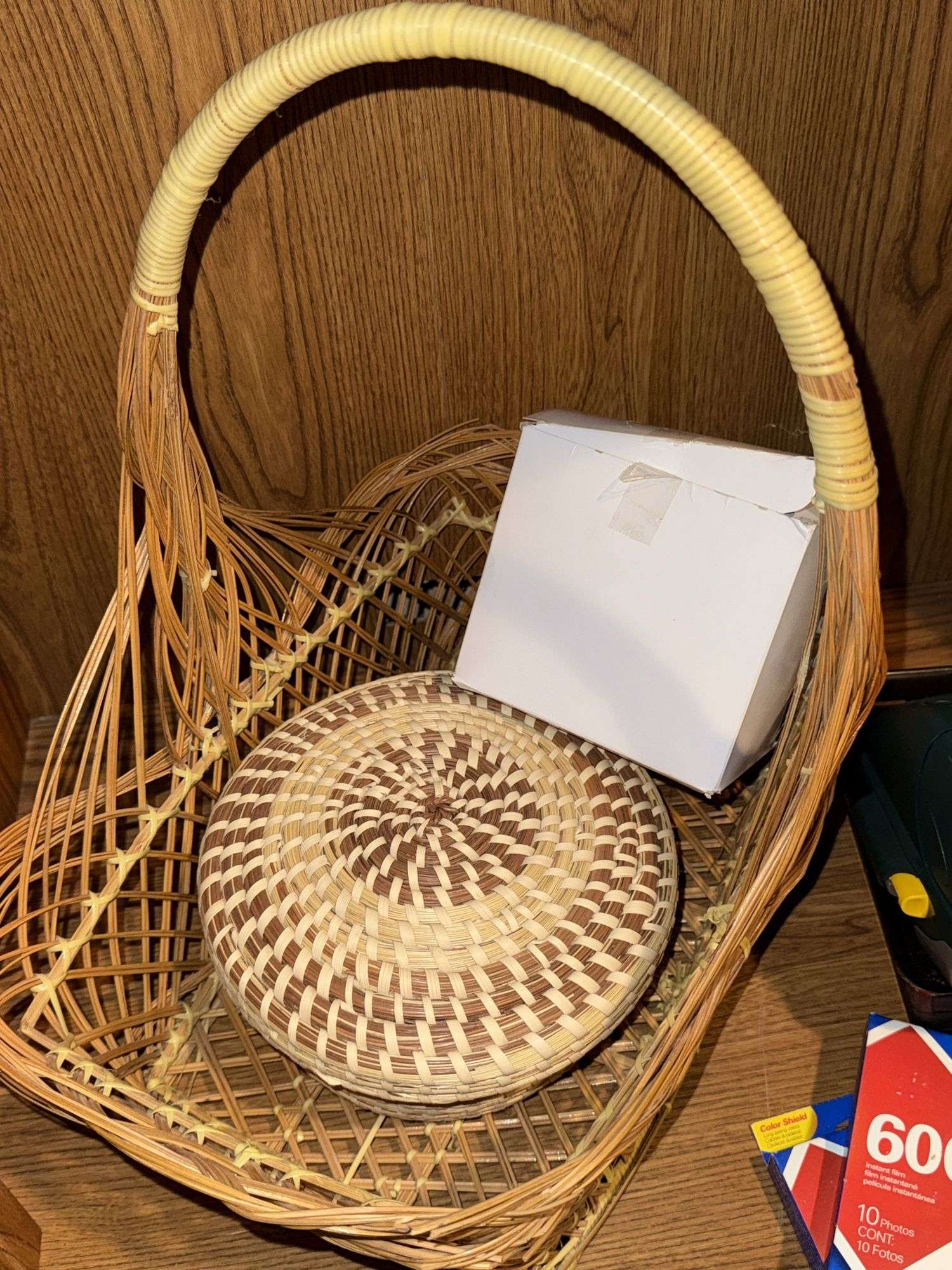 WOVEN BASKETS, POLAROID CAMERA WITH INSTANT FILM, AND PANASONIC LUMIX CAMERA