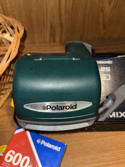 WOVEN BASKETS, POLAROID CAMERA WITH INSTANT FILM, AND PANASONIC LUMIX CAMERA