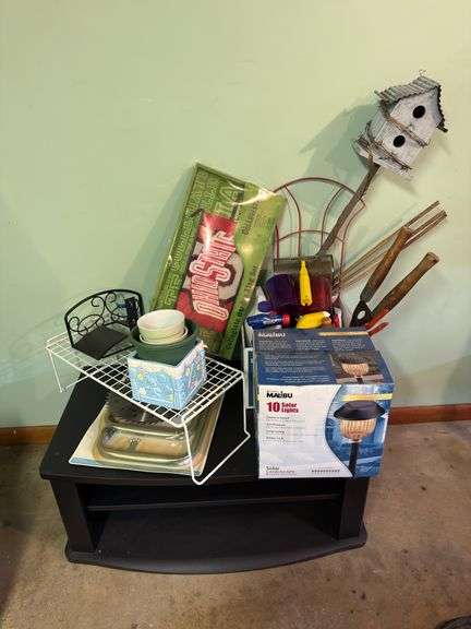TV STAND/CONSOLE WITH ALL CONTENTS PICTURED, INCLUDING OSU GARDEN FLAG, OX OF SOLAR LIGHTS, GARDEN