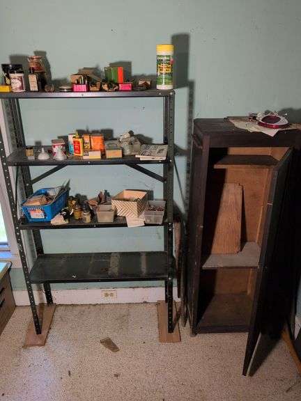 Metal shelving and wooden cabinet with contents