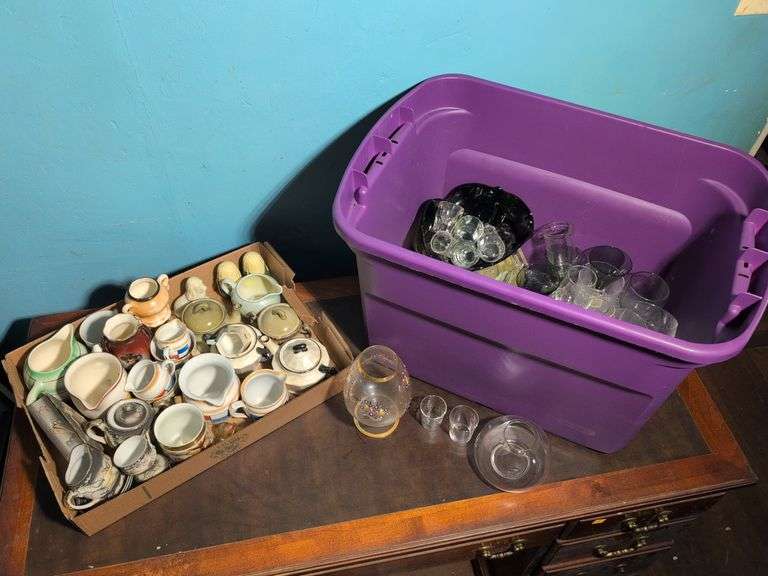 Assortment of glassware and other decorative pieces - pitchers, shot glasses, wine glasses, and more