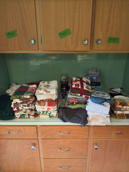 CONTENTS OF COUNTER TOP, TEA TOWELS (SOME NEW), CANDLES,