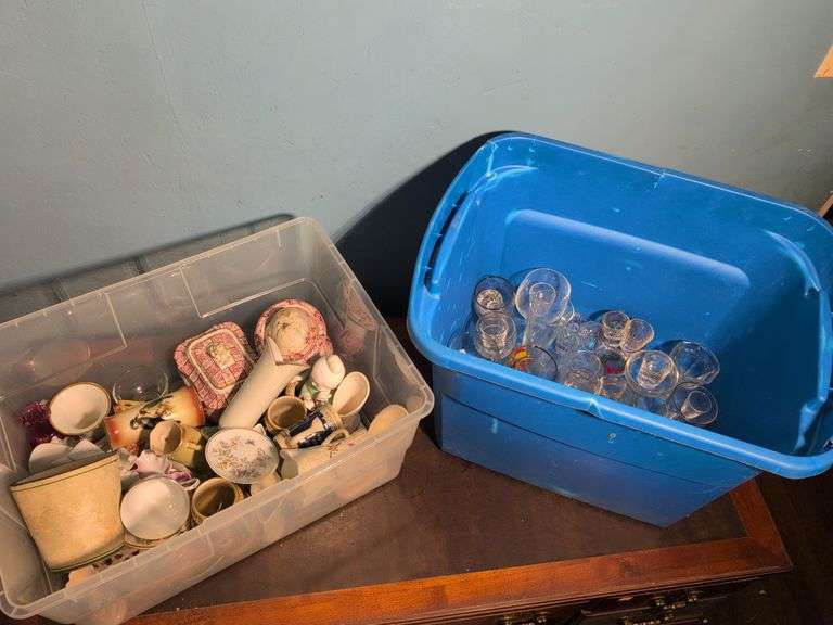 Assortment of glassware and other decorative pieces - shot glasses, wine glasses, vases, and more