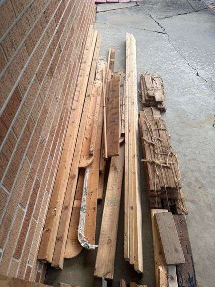 STACK OF MISC. LUMBER WITH 2x4’s , 1x4’s, AND MORE