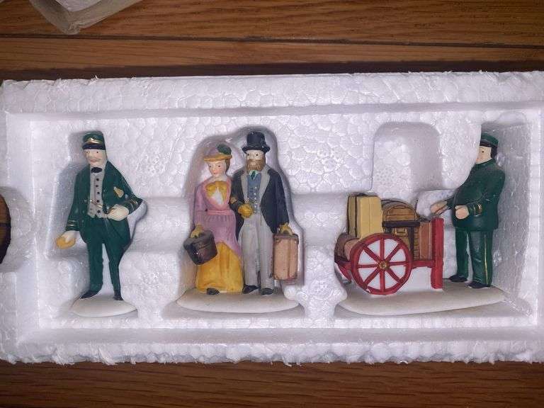 Department 56/Heritage Village “Holiday Travelers” and “A Christmas Beginning”