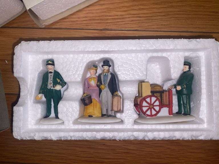 Department 56/Heritage Village “Holiday Travelers” and “A Christmas Beginning”