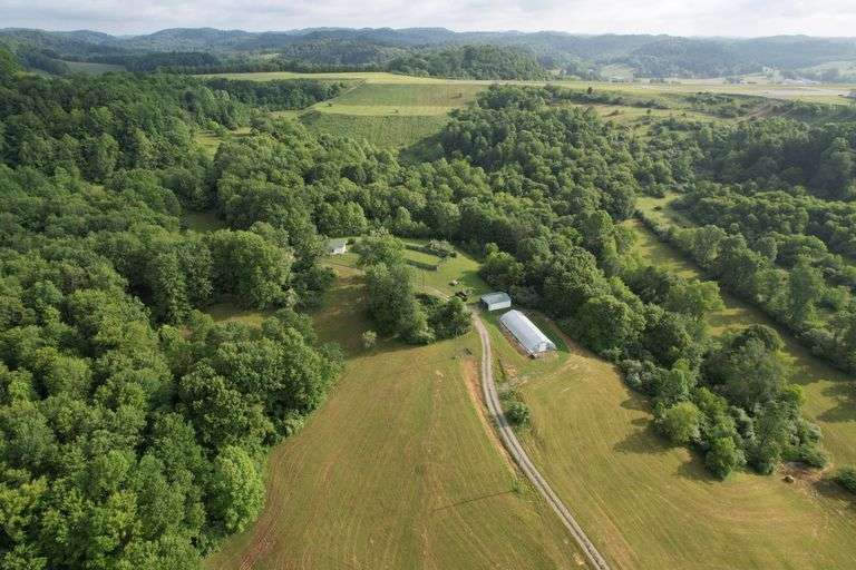 41.97 +/- acres surface with 79.85 +/- acres oil and gas rights, modern farmhouse