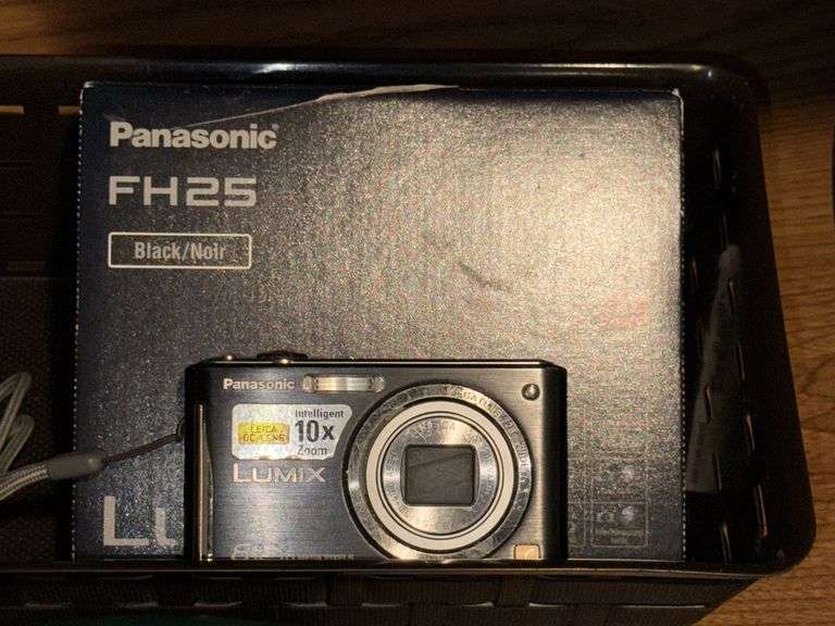 WOVEN BASKETS, POLAROID CAMERA WITH INSTANT FILM, AND PANASONIC LUMIX CAMERA