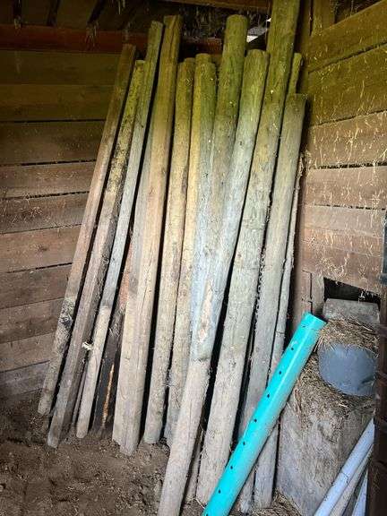 Contents of the Stall - Wood Fence Posts - Woven Wire - Bin