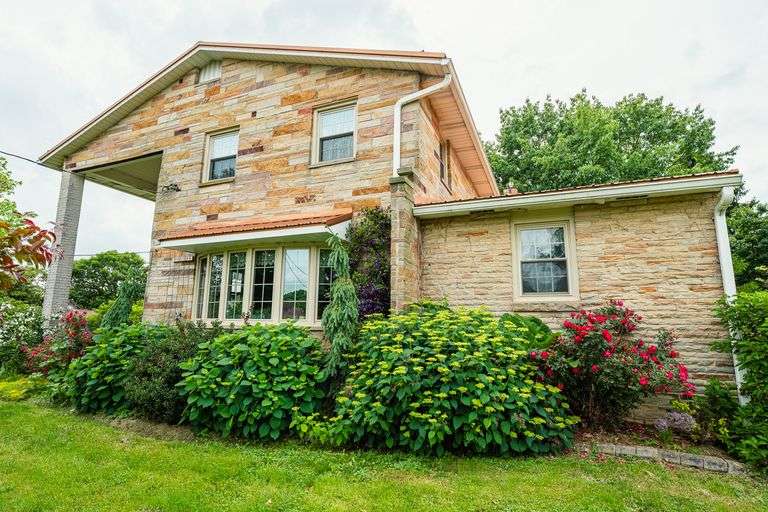5 acres with home and outbuildings