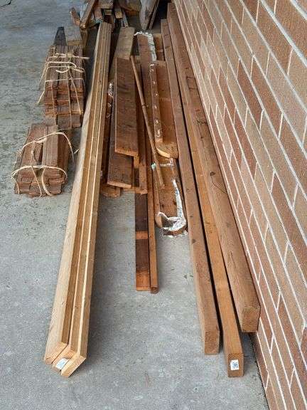 STACK OF MISC. LUMBER WITH 2x4’s , 1x4’s, AND MORE