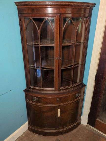 Antique corner China cabinet with curved glass