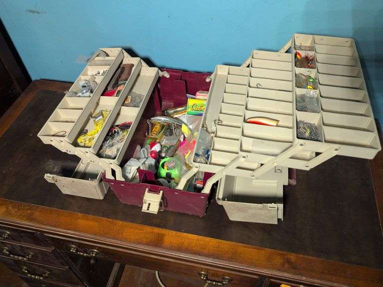 Plano tackle box with lures, bobbers, and other fishing supplies