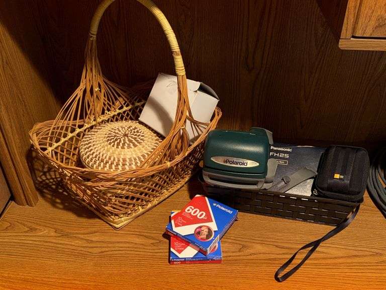 WOVEN BASKETS, POLAROID CAMERA WITH INSTANT FILM, AND PANASONIC LUMIX CAMERA