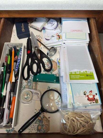 PENS, MAGNIFYING GLASS, NOTEPADS, RUBBERBANDS, MEAT THERMOMETER