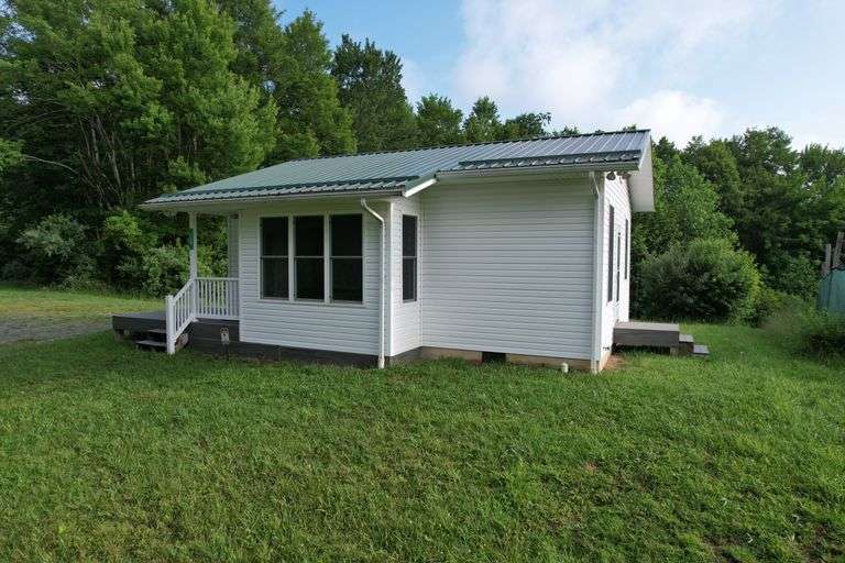 41.97 +/- acres surface with 79.85 +/- acres oil and gas rights, modern farmhouse