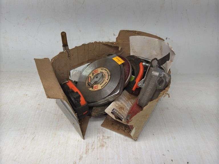 Assortment of Measuring Tapes and Box Cutters