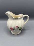 VARIETY OF PITCHERS, VASES, AND SUGAR BOWL