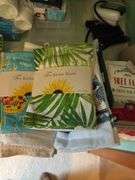 CONTENTS OF COUNTER TOP, TEA TOWELS (SOME NEW), CANDLES,